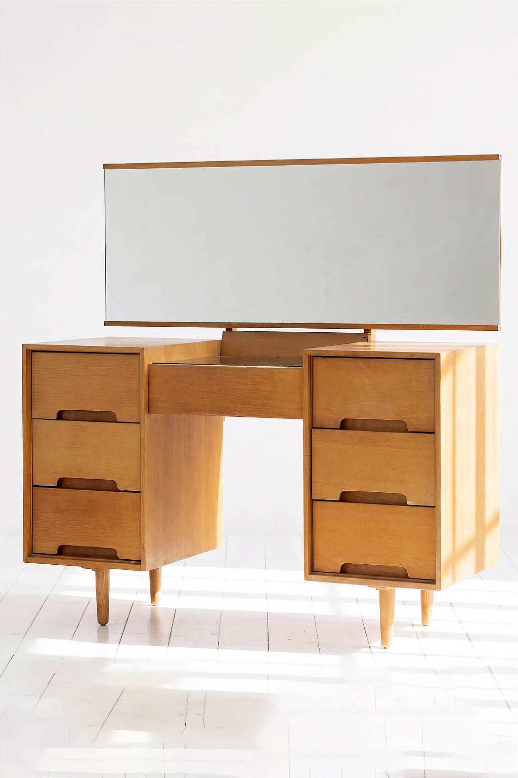 A mid-century 'C Range' dressing table designed by architects John and Sylvia Reid for Stag Furniture in 1953 Evengrain