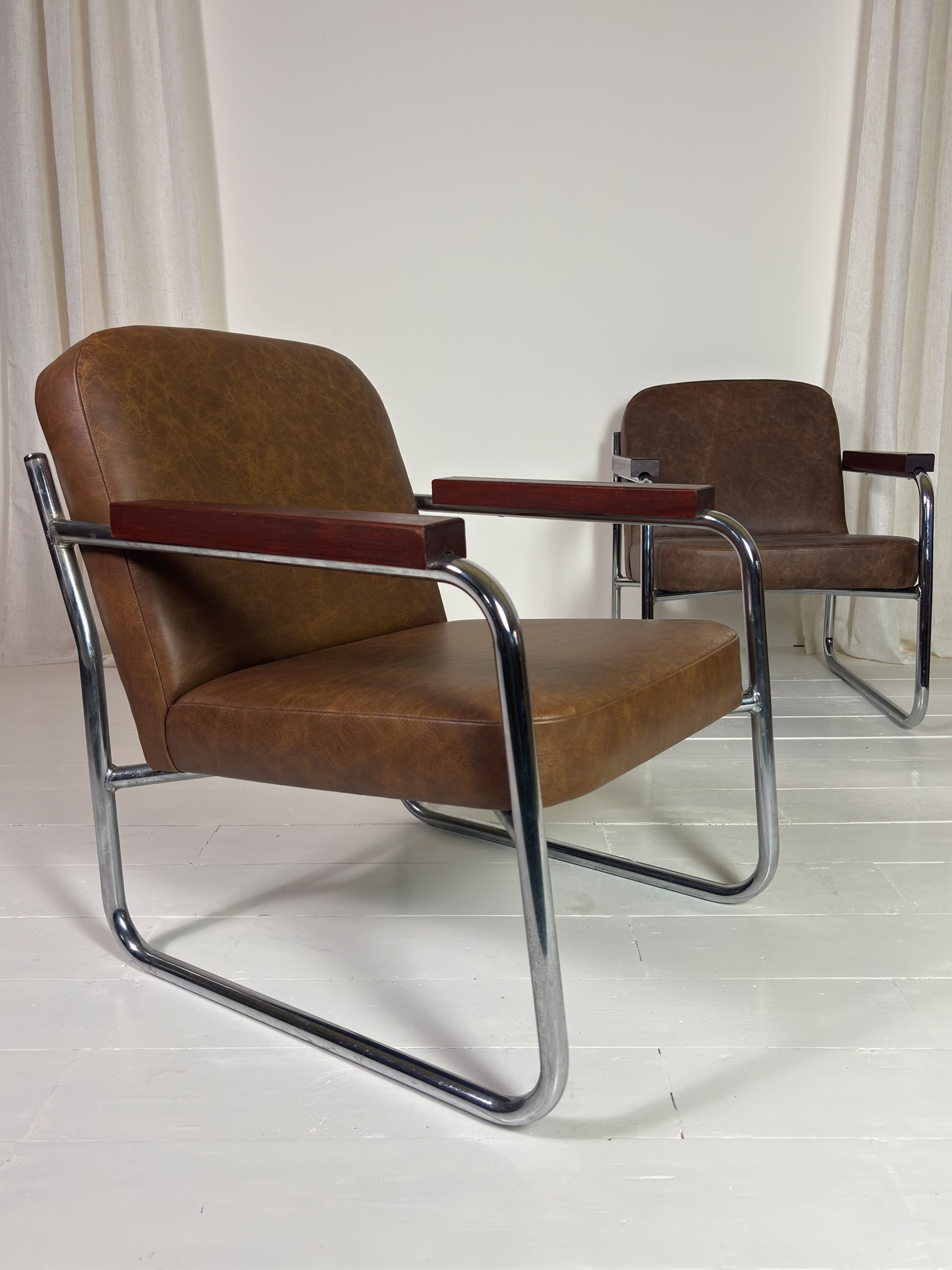 Vintage steel frame armchair with brown leather upholstery