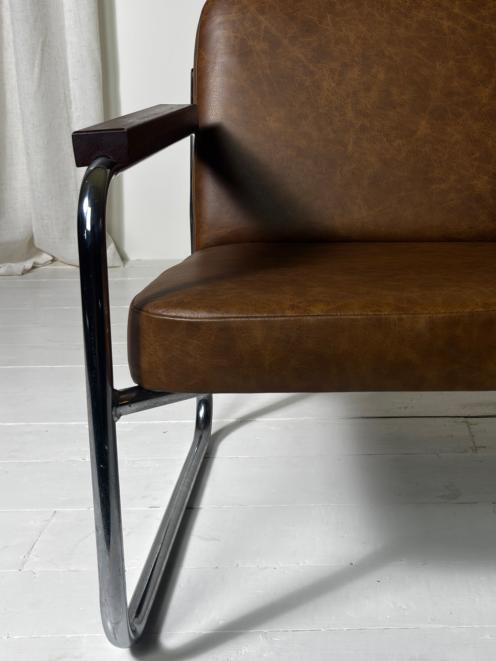 Vintage steel frame armchair with brown leather upholstery