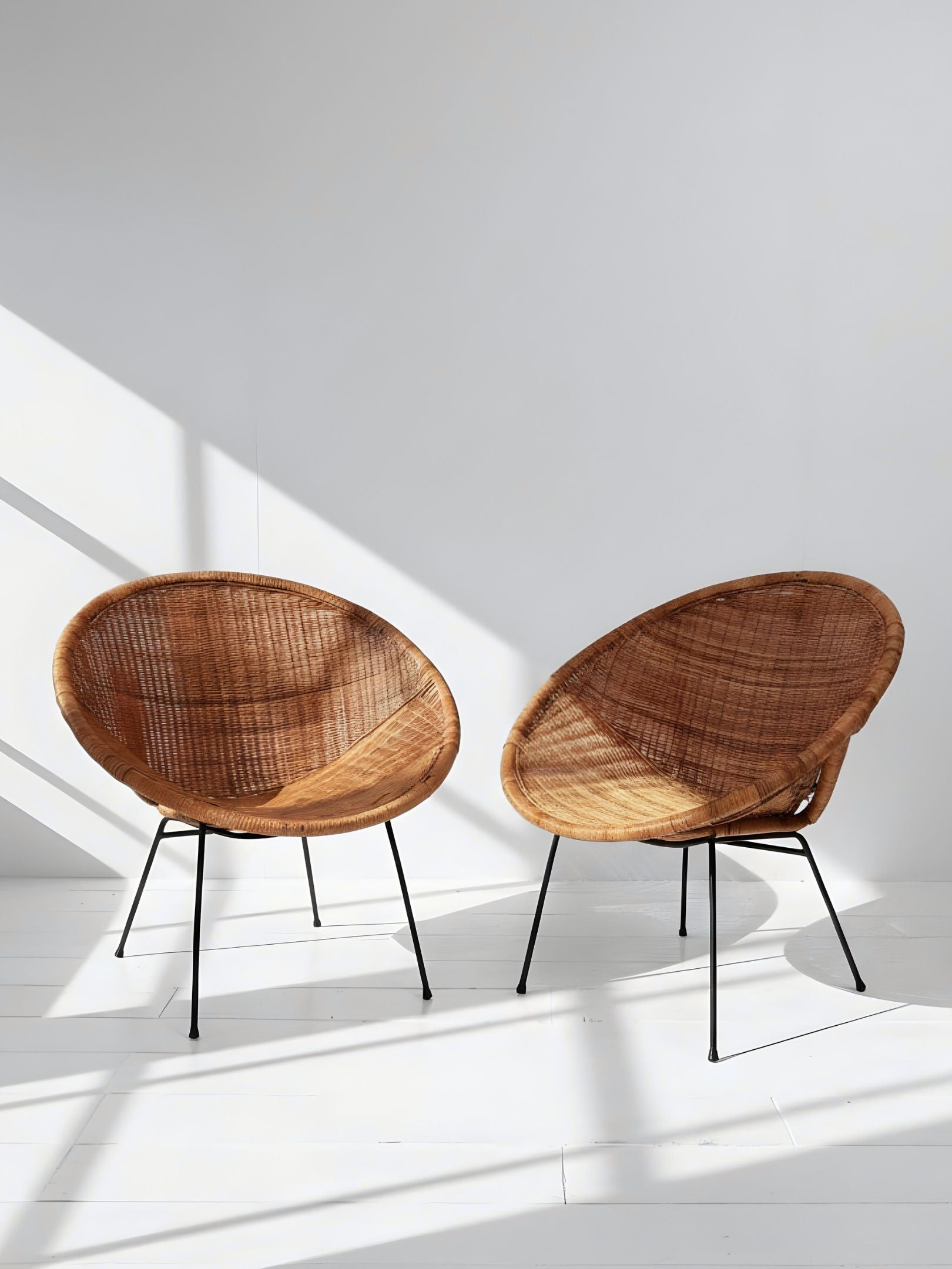 Pair of Vintage “Satellite” Wicker Chairs (C. 1950s)