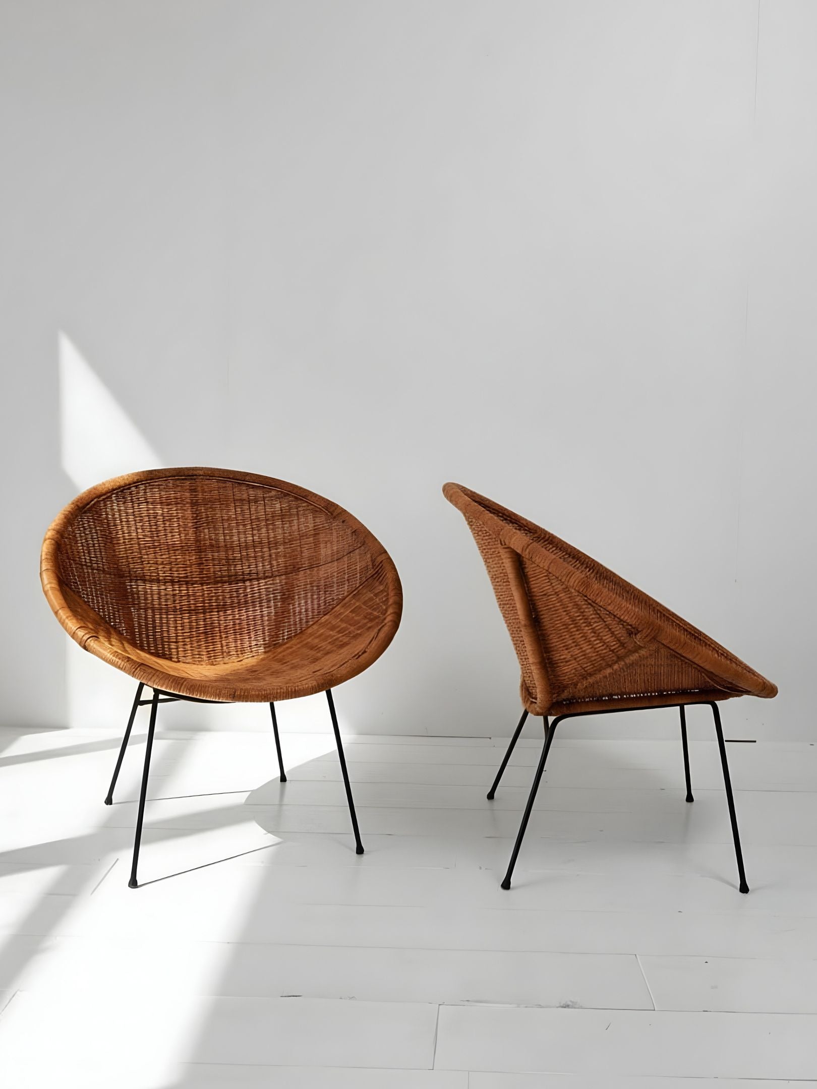 Pair of Vintage “Satellite” Wicker Chairs (C. 1950s)