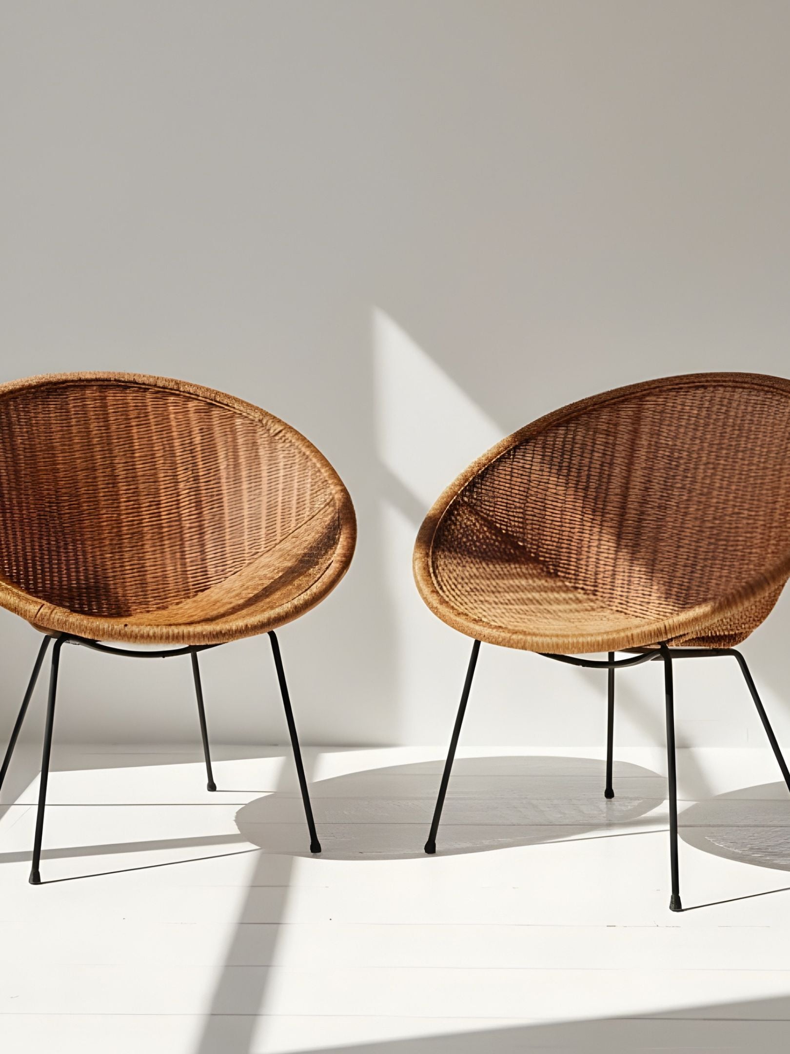 Pair of Vintage “Satellite” Wicker Chairs (C. 1950s)